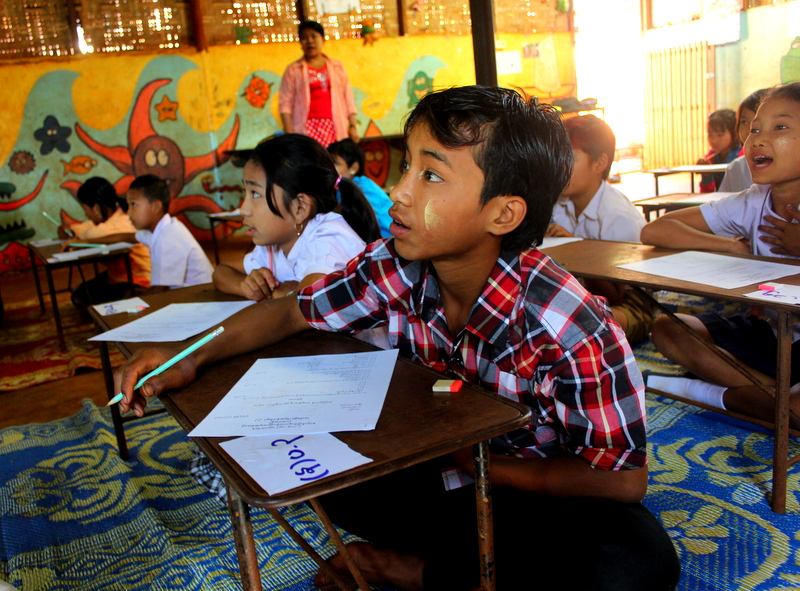 An NFPE classroom at a Learning Center, with boy student featured in forefront